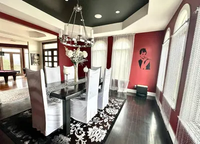 a dining room with red walls and a dining table at Room with a view in the Hills of Studio City -B in Studio City