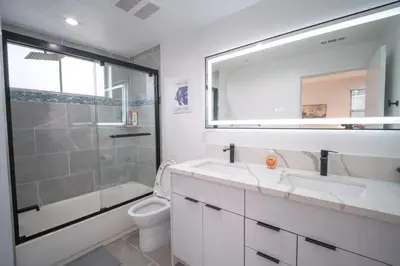 a bathroom with a shower and a sink and a toilet at Stylish Private Room by Downtown LA in Los Angeles