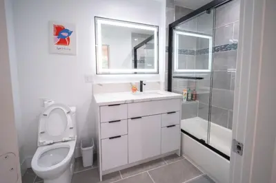a bathroom with a toilet and a sink and a shower at Stylish Private Room by Downtown LA in Los Angeles