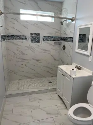 a bathroom with a shower and a toilet and a sink at Hollywood Homes of Love in Los Angeles