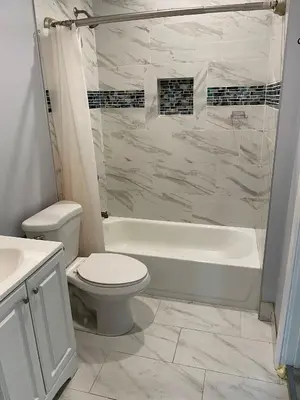 a bathroom with a tub and a toilet and a sink at Hollywood Homes of Love in Los Angeles