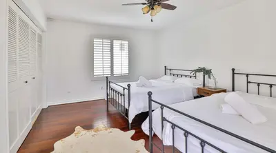 a bedroom with two beds and a ceiling fan at Estate with Heated Pool & Jacuzzi & Tennis Court in Sherman Oaks Community Hospital Heliport