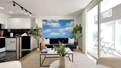 a living room with a couch and a kitchen at Seabreeze Hideaway one bedroom in Los Angeles