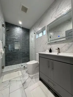 a bathroom with a toilet and a sink and a shower at Newly constructed 2 bedroom by La Cienega Plaza with parking, modern kitchen, washer dryer and very central to attractions in Los Angeles