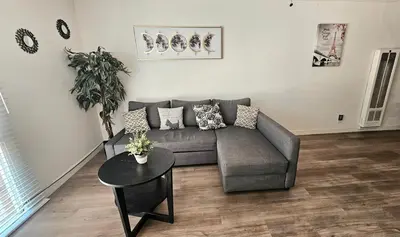 a living room with a couch and a table at Spacious Silverlake Apartment in Los Angeles