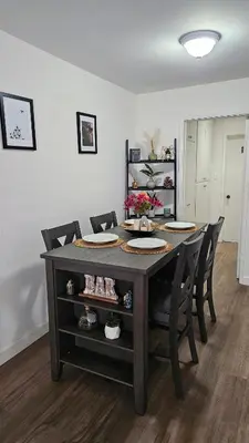a dining room with a table and some chairs at Spacious Silverlake Apartment in Los Angeles