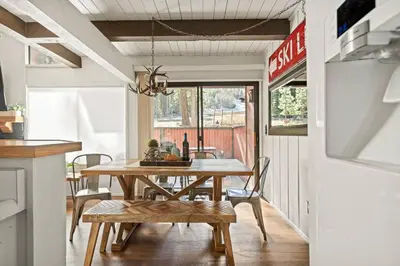 a kitchen and dining room with a table and chairs at Summit Slope Side in Big Bear Lake