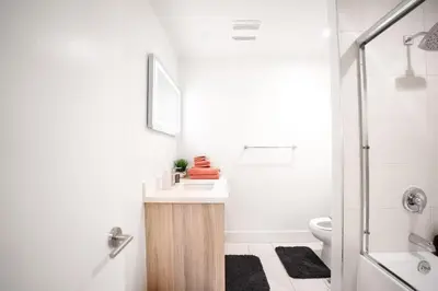 a bathroom with a sink and a toilet and a shower at Pacific Pearl 2 bed Apt with FREE PARKING in Santa Monica in Los Angeles