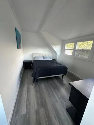 a bedroom with a bed in a attic at Luxury Master Bedroom with private bathroom walking distance to Sofi Stadium, KIA Forum and Intuit Dome also only train stop away from LAX airport Perfect place for tourists and event attendees in Inglewood