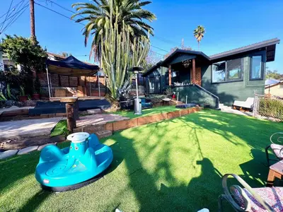 a house with a fake lawn in front of it at The Perch- Hilltop Bungalow, Eagle Rock-near DTLA in Los Angeles