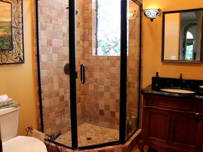 a bathroom with a glass shower with a sink at Romantic and Relaxing Villa Retreat with a Jacuzzi near Somis, California in Somis
