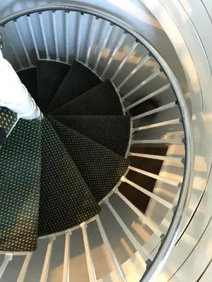 a metal spiral staircase in a building at Unique Three-Level Dome near Lake Gregory in Crestline, California in Crestline