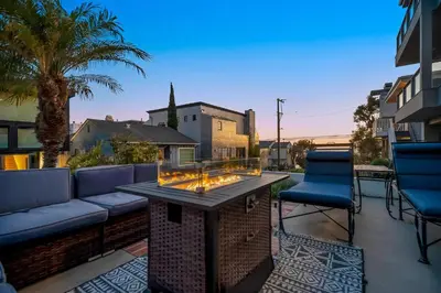 a patio with a fire pit and two chairs at Manhattan Beach Guest Suite in Manhattan Beach