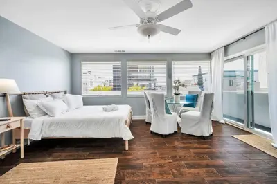 a bedroom with a bed and a table and chairs at Manhattan Beach Guest Suite in Manhattan Beach