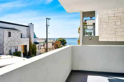 a view of the ocean from the balcony of a house at Manhattan Beach Guest Suite in Manhattan Beach