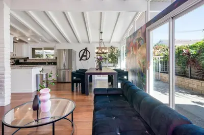 a living room with a couch and a table at Avengers HQ - Hot Tub - Close to Disney - Parking in Anaheim