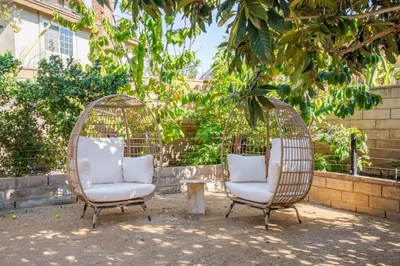 two chairs and a table in a yard at Avengers HQ - Hot Tub - Close to Disney - Parking in Anaheim