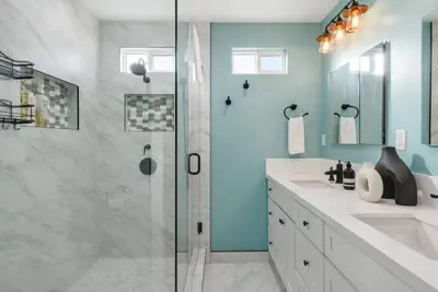 a bathroom with a shower and a sink at Splash Haven-Heated Pool-Huge Living Area-Sleeps 8 in Long Beach