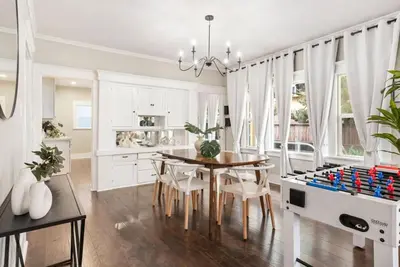 a dining room with a table and a lego game at Sunset Shores - Near the beach - Games - Sleeps 8 in Long Beach