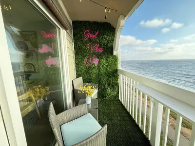 a balcony with chairs and a view of the ocean at Redondo Oceanfront Gem 2BR BA Balcony & Parking 335 in Redondo Beach