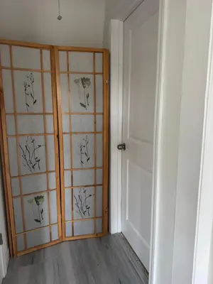a room with a door and a wall with drawings on it at Walk of Fame 1 Bedroom with shared bathroom and kitchen in Los Angeles
