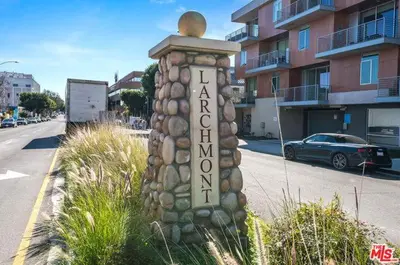 a pole with a sign on the side of a street at Guest House in Los Angeles