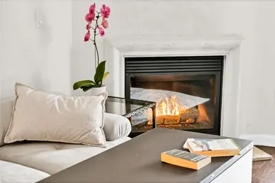 a living room with a couch and a fireplace at Lux Oasis in Woodland Hills in Los Angeles
