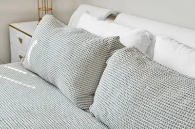 a bed with three pillows on it at Lux Oasis in Woodland Hills in Los Angeles