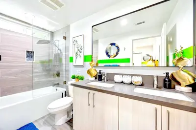 a bathroom with a sink and a toilet and a tub at B- InstaWorthy & Family-Friendly NoHo Gem- Near Universal & Hollywood with Parking, Games, and Hot Tub in North Hollywood
