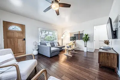 a living room with a couch and a ceiling fan at 3BR Santa Monica Home, Ideal for Groups! in Los Angeles