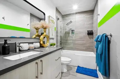 a bathroom with a sink and a toilet and a tub at C- Vibrant and Glam NoHo Pad near U-Studios and H-Sign in North Hollywood