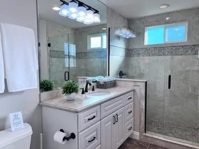 a bathroom with a sink and a shower at Sensational 6 Bedroom 4 Bathroom Pool Home (3 Master Bedrooms W/bathrooms) in Anaheim