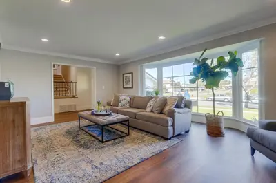 a living room with a couch and a table at Gorgeous Upgraded 5 Bedroom & 3 Bath Home with pool in Orange