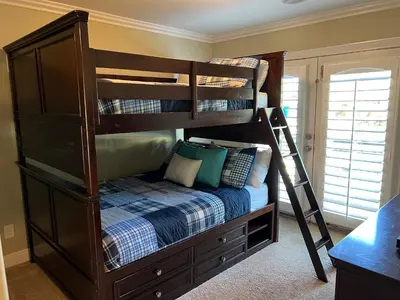 a bedroom with a bunk bed with a ladder at Amazing Large Family Home w/Pool, 1 Mile to Disney in Anaheim
