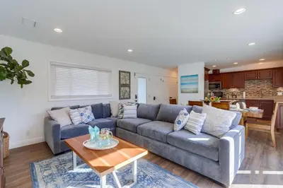 a living room with a couch and a table at Beautiful Remodel 3 Bedroom 2 bathroom Home with Pool & Jacuzzi in Fullerton
