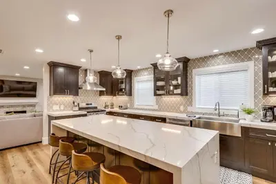 a large kitchen with a large white counter top at Gorgeous Upgraded 5 Bedroom & 4 Bath Home with Jacuzzi in Orange