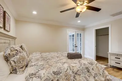 a bedroom with a bed and a ceiling fan at Gorgeous Upgraded 5 Bedroom & 4 Bath Home with Jacuzzi in Orange