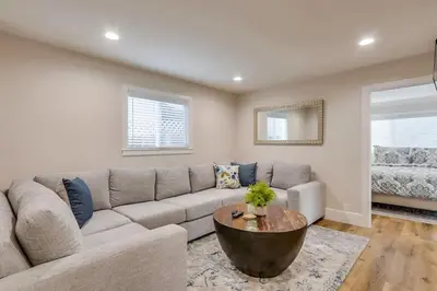 a living room with a couch and a table at Gorgeous Upgraded 5 Bedroom & 4 Bath Home with Jacuzzi in Orange
