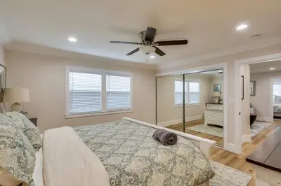 a bedroom with a bed and a ceiling fan at Gorgeous Upgraded 5 Bedroom & 4 Bath Home with Jacuzzi in Orange