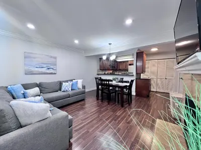 a living room with a couch and a table at Luxurious 2 Bedroom Condo Shortest Walk To Disney in Anaheim