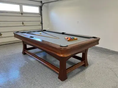 a pool table with cue balls on top of it at Awesome 5 bedroom 3 bath pool home with in-ground jacuzzi in Orange