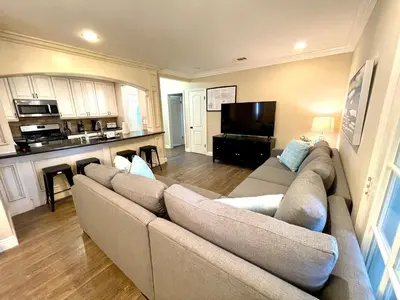 a living room with a couch and a television at Wonderful 4 Bedroom 3 Bath Pool Home 3/4 Mile To Disney in Anaheim