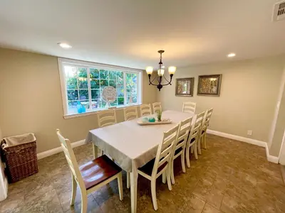 a dining room with a table and chairs at Wonderful 4 Bedroom 3 Bath Pool Home 3/4 Mile To Disney in Anaheim