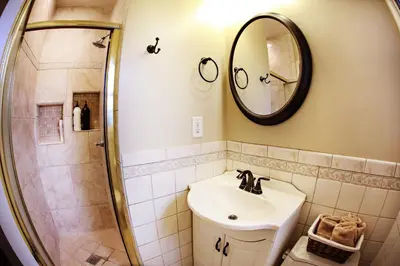 a bathroom with a sink and a shower at Wonderful 4 Bedroom 3 Bath Pool Home 3/4 Mile To Disney in Anaheim