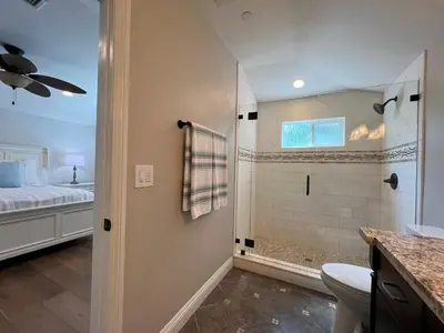 a bathroom with a shower and a toilet at Fantastic 6 bedroom, 45 bath home (4 master Suites), pool home in Anaheim