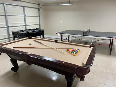 a ping pong table with two ping pong balls on it at Fantastic 6 bedroom, 45 bath home (4 master Suites), pool home in Anaheim