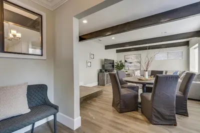 a dining room and living room with a table and chairs at 5 Bedroom plus loft room, 3 Bath home in Fullerton