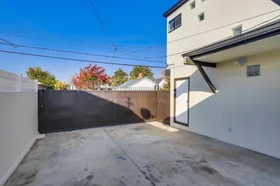 a driveway of a house with a fence at 5 Bedroom plus loft room, 3 Bath home in Fullerton