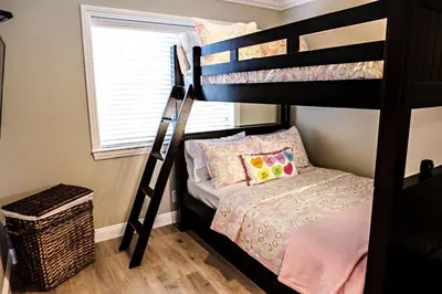 a bedroom with two bunk beds and a window at Adorable 3 Bedroom 2 Bath Home in Fullerton