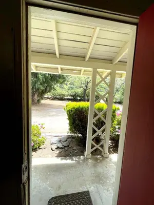 an open door to a patio with a view at Sierra Pelona Motel in Santa Clarita
